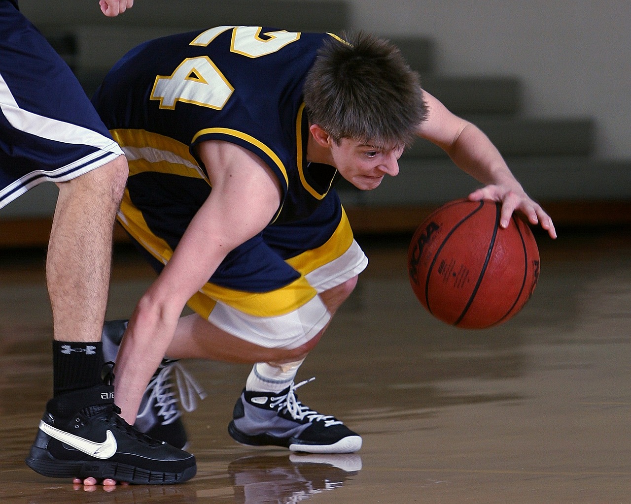 man dribbling a basketball